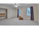 Cozy bedroom features ample closet space, carpeted floors, and lots of natural light at 207 Old Forest Creek Dr, Chapel Hill, NC 27514