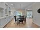 Dining room features a built-in cabinet, a window bench, and views into an open floorplan at 207 Old Forest Creek Dr, Chapel Hill, NC 27514