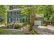 Charming two-story home features a brick walkway, mature landscaping, and a convenient attached garage at 207 Old Forest Creek Dr, Chapel Hill, NC 27514