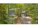 Charming two-story home features a brick walkway, mature landscaping, and a convenient attached garage at 207 Old Forest Creek Dr, Chapel Hill, NC 27514