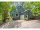 Exterior featuring driveway and attached garage at 207 Old Forest Creek Dr, Chapel Hill, NC 27514