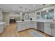 An open kitchen with stainless steel appliances, breakfast bar and light colored cabinetry at 207 Old Forest Creek Dr, Chapel Hill, NC 27514