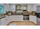 Modern kitchen with stainless steel appliances, custom cabinets, and a tile backsplash at 207 Old Forest Creek Dr, Chapel Hill, NC 27514