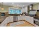 Bright kitchen featuring stainless steel appliances and ample counter space at 207 Old Forest Creek Dr, Chapel Hill, NC 27514
