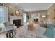 Bright living room with hardwood floors, fireplace, and access to the dining area at 207 Old Forest Creek Dr, Chapel Hill, NC 27514