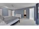 Large primary bedroom with neutral carpet, ceiling fan and ensuite bathroom at 207 Old Forest Creek Dr, Chapel Hill, NC 27514