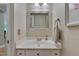 Elegant powder room with a decorative mirror, and a white countertop at 207 Old Forest Creek Dr, Chapel Hill, NC 27514