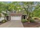 Charming two-story brick home featuring a two-car garage and well-maintained landscaping at 2073 Weston Green Loop, Cary, NC 27513