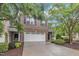 Charming brick townhome with a two-car garage, manicured landscaping, and a welcoming entrance at 2073 Weston Green Loop, Cary, NC 27513