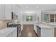Bright kitchen with stainless steel appliances, white countertops, and open layout at 2073 Weston Green Loop, Cary, NC 27513
