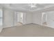 Spacious main bedroom with neutral walls and plush carpet offers serene retreat with easy access to ensuite bathroom at 2073 Weston Green Loop, Cary, NC 27513