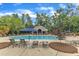 Community swimming pool area, complete with ample seating, umbrellas and shaded gazebo at 2073 Weston Green Loop, Cary, NC 27513