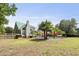Expansive backyard offers a swimming pool, hammocks, palm trees, and ample space at 213 Birch Creek Dr, Fuquay Varina, NC 27526