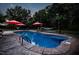 Gorgeous backyard pool oasis with hammocks, umbrellas and lush greenery for ultimate relaxation and recreation at 213 Birch Creek Dr, Fuquay Varina, NC 27526
