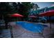 Beautiful backyard pool with a unique shape, surrounded by a concrete patio, perfect for summer fun at 213 Birch Creek Dr, Fuquay Varina, NC 27526