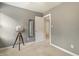 Neutral bedroom featuring a globe, mirror, light gray walls, and tan carpet at 213 Birch Creek Dr, Fuquay Varina, NC 27526