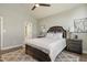 This bedroom features modern decor, a ceiling fan, plus an ensuite bathroom at 213 Birch Creek Dr, Fuquay Varina, NC 27526