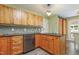 The kitchen features wooden cabinets, granite countertops, stone backsplash, and stainless steel appliances at 213 Birch Creek Dr, Fuquay Varina, NC 27526