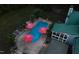 In-ground swimming pool complete with umbrellas, deck chairs, lush landscaping, and custom lighting at 213 Birch Creek Dr, Fuquay Varina, NC 27526