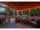 Cozy screened-in porch with comfortable seating, offering a relaxing view of the pool and backyard at 213 Birch Creek Dr, Fuquay Varina, NC 27526