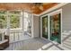 Inviting sunroom with ceiling fan, stylish rug, and access to screened porch at 213 Birch Creek Dr, Fuquay Varina, NC 27526