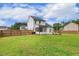 Spacious backyard showcasing a patio, screened porch, and well-manicured lawn, great for entertaining at 22 Chapman Ct, Wendell, NC 27591