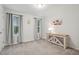 Bright bedroom featuring neutral colored walls, two windows and a console table at 22 Chapman Ct, Wendell, NC 27591