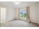 Bright bedroom with large window, walk-in closet and soft neutral carpet at 22 Chapman Ct, Wendell, NC 27591