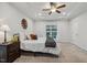 Cozy bedroom with bedside table, lamp, and natural light at 22 Chapman Ct, Wendell, NC 27591