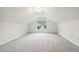 Carpeted bonus room with a large window, offering natural light and a bright, flexible space at 22 Chapman Ct, Wendell, NC 27591