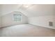 A well-lit bonus room features plush carpeting and natural light at 22 Chapman Ct, Wendell, NC 27591