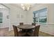 Cozy dining room featuring a round table, stylish lighting, and large window at 22 Chapman Ct, Wendell, NC 27591