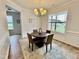 Charming dining area with a round table, large window, and neutral color palette at 22 Chapman Ct, Wendell, NC 27591