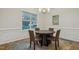 Dining room showcases a round table, four chairs, and a bright window at 22 Chapman Ct, Wendell, NC 27591