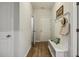 Hallway features hardwood floors, coat hooks, bench, and entry door at 22 Chapman Ct, Wendell, NC 27591