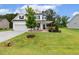 Charming two-story home with black shutters, an attached garage, and a well-manicured lawn at 22 Chapman Ct, Wendell, NC 27591