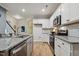 Kitchen features granite countertops, stainless steel appliances, and white subway tile backsplash at 22 Chapman Ct, Wendell, NC 27591