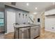 Kitchen island with seating, stainless steel dishwasher, and stylish faucet and cabinets at 22 Chapman Ct, Wendell, NC 27591