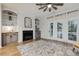 Living room featuring neutral walls, fireplace, built-ins, and access to outdoor patio at 22 Chapman Ct, Wendell, NC 27591