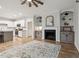 Open-concept living room featuring a fireplace, built-in shelves, and a spacious layout at 22 Chapman Ct, Wendell, NC 27591