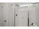 Bathroom shower with glass doors and a modern shower head fixture at 22 Chapman Ct, Wendell, NC 27591