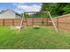 Backyard wooden swing set with multiple swings and a sandbox, perfect for Gathering fun and play at 22 Chapman Ct, Wendell, NC 27591