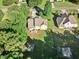 An aerial view of home showcasing the backyard with soccer goal and patio at 2207 Wimberly Woods Dr, Sanford, NC 27330