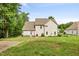 Expansive backyard with well-maintained lawn, patio area, mature trees, and fence at 2207 Wimberly Woods Dr, Sanford, NC 27330