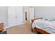 This is a cozy bedroom that includes a bed and closet with carpeted floors at 2207 Wimberly Woods Dr, Sanford, NC 27330