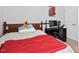 Bedroom with a queen-sized bed, a view of the backyard, and modern décor at 2207 Wimberly Woods Dr, Sanford, NC 27330