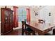 Inviting dining room with a large table, cabinet, and natural light from the window at 2207 Wimberly Woods Dr, Sanford, NC 27330