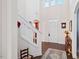 Light-filled foyer with a staircase, hardwood floors, and elegant decor at 2207 Wimberly Woods Dr, Sanford, NC 27330