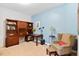 Comfortable home office with a desk, bookcase, and cozy chair at 2207 Wimberly Woods Dr, Sanford, NC 27330