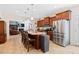 Open kitchen with large island, stainless steel appliances, and bar stool seating at 2207 Wimberly Woods Dr, Sanford, NC 27330